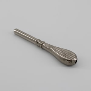 May include: A silver-colored, metal wine bottle stopper. The stopper has a long, cylindrical stem and a textured, teardrop-shaped handle. The handle has a series of parallel grooves. The stopper is designed to seal a wine bottle.