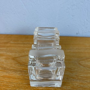 May include: A clear glass rectangular dish with a frosted design. The dish is made of multiple stacked pieces of glass.