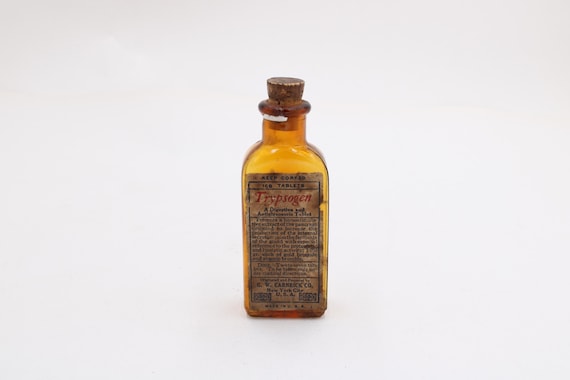 Antike Arzneiflasche „Trypsogen“ – G. W. Carnrick Co. New York – Braunglas-Fläschchen leer (H ≈ 10 cm · B ≈ 4 cm) S9