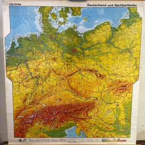 May include: A vintage map of Germany and neighboring countries, printed on a yellow and green background with red and brown accents. The map is titled "Deutschland und Nachbarländer" and is printed by "List Verlag".