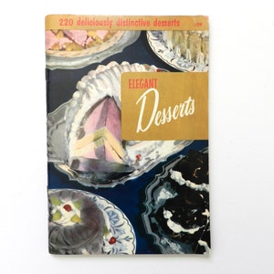 May include: Vintage cookbook titled "Elegant Desserts" with a cover showing illustrations of various desserts on silver platters. The cover has a gold banner with the title in script and the text "220 deliciously distinctive desserts".