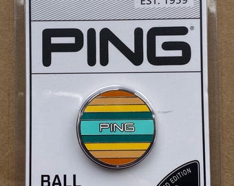 Quality birthday golf gift. Superbly designed Enamel Coastal Ping Golf Ball Marker. A limited edition Ping Collectors item. 30mm diam. NEW