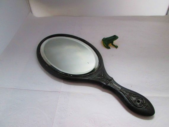 Antique Black Gutta Percha Oval Hand Mirror by Flo