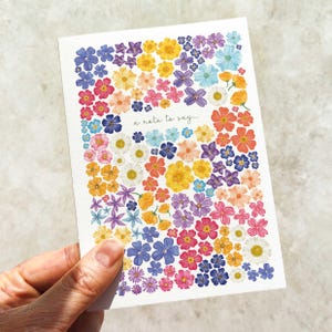 Petite carte de correspondance et enveloppe florales festives lumineuses et colorées