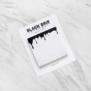 May include: Black and white sticky notes with a dripping black paint design. The notes say "Black Drip Sticky Notes" and "Muze Lab".