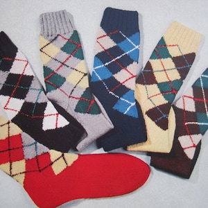 May include: Six pairs of argyle socks in various colors, including red, blue, green, brown, and gray. The socks have a diamond pattern.