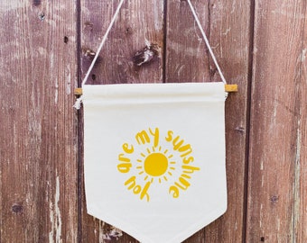 Wall hanging canvas pendant flag ‘you are my sunshine’ in yellow vinyl. Kids room, happy summer vibes wall decor