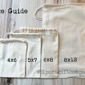 May include: Size guide for four white cotton drawstring bags with red stitching. The bags are arranged from smallest to largest, with the measurements printed on each bag: 4x6, 5x7, 6x8, and 8x12. The bags are on a light wood surface. The text "@Kportgiftcompany" is printed on the largest bag.