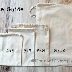 May include: Size guide for four white cotton drawstring bags with red stitching. The bags are arranged from smallest to largest, with the measurements printed on each bag: 4x6, 5x7, 6x8, and 8x12. The bags are on a light wood surface. The text "@Kportgiftcompany" is printed on the largest bag.
