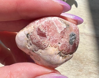 Lovely Rhodochrosite tumble with deep pink saturation and beautiful banding