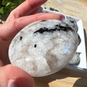 Rainbow moonstone palm polished crystal with blue flash