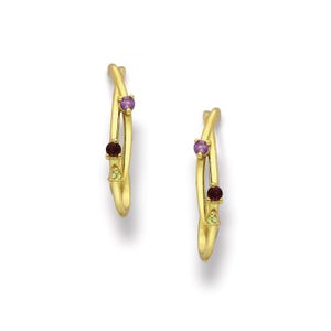 May include: Gold hoop earrings with a twisted design and three gemstones: a purple amethyst, a green peridot, and a red garnet.