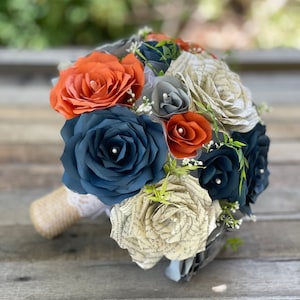 Bridal bouquet in burnt orange, navy blue and gray filter paper and book page paper flowers