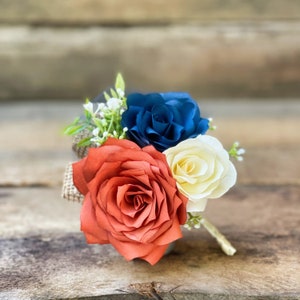 Paper Flower Pin On Corsage in Burnt Orange and Navy blue