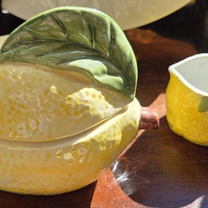 May include: A rustic wooden sign with the text "Welcome to our home" in white lettering. The sign features a distressed finish and a simple, inviting design, perfect for entryway decor.