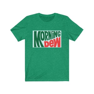 May include: A green t-shirt with a white rectangle featuring the text "MORNING DEW" in green and red letters.