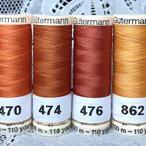 6 NEW different orange 110 yard spools 100% polyester GUTERMANN sew-all thread
