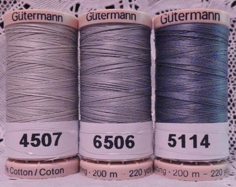 May include: Three spools of Gütermann thread in shades of gray and blue. The spools are labeled with the numbers 4507, 6506, and 5114. Each spool is 200 meters or 220 yards.