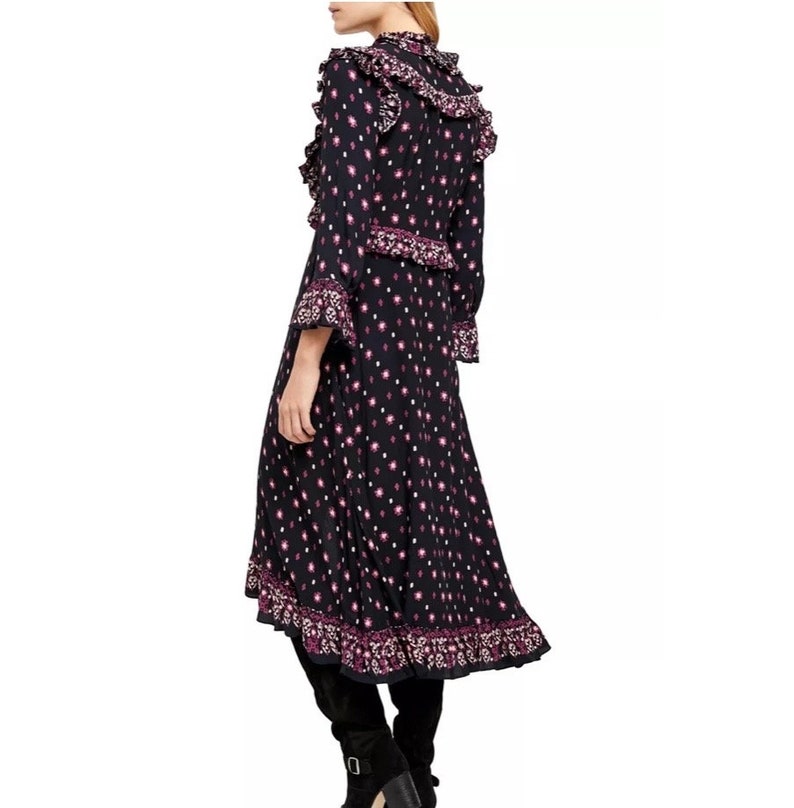 May include: A black midi dress with a pink and white floral print. The dress has a ruffled neckline and long sleeves. The dress has a high-low hemline.