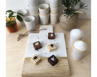 Marble and Mango wood serving board, in rectangle form with brass detail