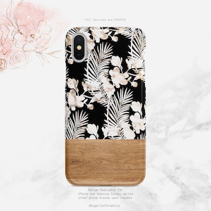 May include: A black phone case with a white floral and leaf pattern. The bottom half of the case is a wood grain design. The text *All Textures are PRINTED* is at the top of the image. The text *Design Available For iPhone and Samsung Galaxy series other phone brands upon request @SugarloafGraphics* is at the bottom of the image.