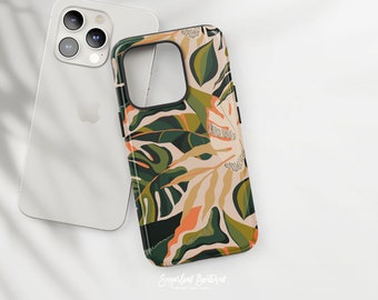 May include: A black phone case with a tropical leaf pattern in shades of green, orange, and beige. The case has a cutout for the camera lens and a raised lip around the edges to protect the screen.