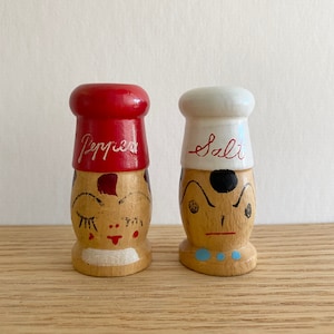 Vintage salt and pepper shakers in red and white chef hats made in Japan mid century