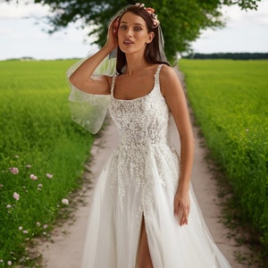 Sleeveless A-Line Boho Wedding Dress with Backless Design, Straps, and Square Neck Sweep Train Bridal Gown Ivory Sparkle Tulle Side Slit