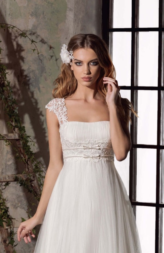 Empire waist A-line wedding dress with long sleeves