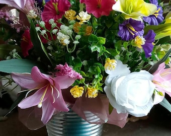 Grave site or just a floral arrangemen is perfect for cemetery grave site.  spring and summer flowers