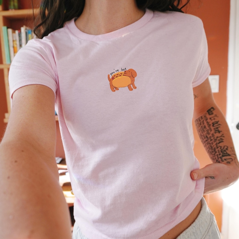 flirty hot dog you're hot baby tee