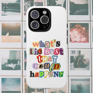 May include: White phone case with a colorful collage design. The text "what's the BEST THAT COULD HAPPEN?" is displayed in a variety of cut-out letter styles. The phone case has a triple-lens camera.