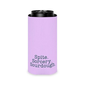 Can cooler featuring a dark serif font design that reads “Spite. Sorcery. Sourdough.” printed on a purple background.