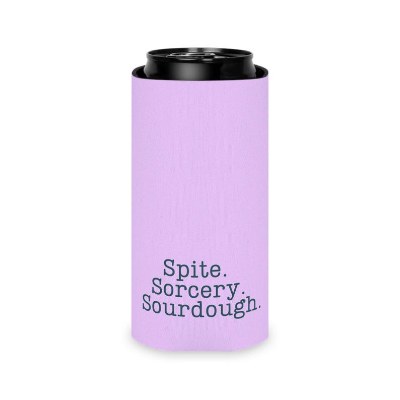 Can cooler featuring a dark serif font design that reads “Spite. Sorcery. Sourdough.” printed on a purple background.