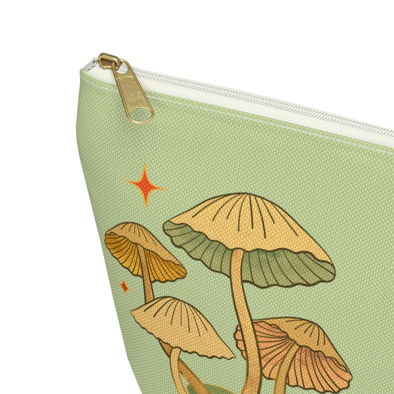 T-bottom pouch in moss green with a mushroom and the words Gorgeous Goblin Gear on the front and a cute snail with a positive message of You're doing great! on the back. Black zipper