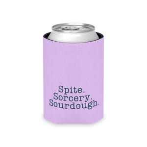 Can cooler featuring a dark serif font design that reads “Spite. Sorcery. Sourdough.” printed on a purple background.