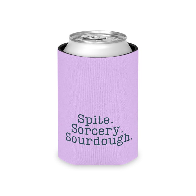 Can cooler featuring a dark serif font design that reads “Spite. Sorcery. Sourdough.” printed on a purple background.