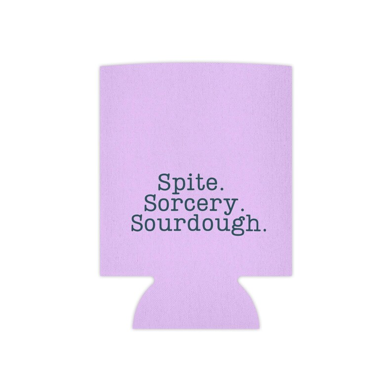 Can cooler featuring a dark serif font design that reads “Spite. Sorcery. Sourdough.” printed on a purple background.