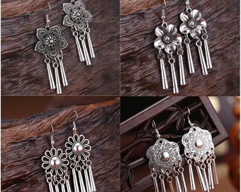 Spiritual earrings with fertility goddess charms and combined with water bleu clay beads