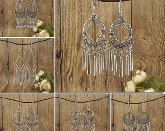 Spiritual earrings with fertility goddess charms and combined with water bleu clay beads