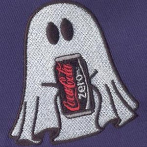 May include: A white ghost holding a can of Coca-Cola Zero. The ghost has two black eyes and a black mouth.