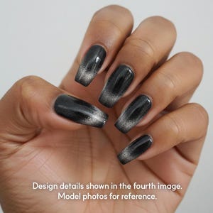 May include: Close-up of a hand with long, black, coffin-shaped nails. Each nail has a glossy black base that fades to a silver glitter tip. The text at the bottom reads: Design details shown in the fourth image. Model photos for reference.