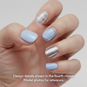 May include: Close-up of a hand with manicured nails. The nails are painted in various styles, including light blue, silver glitter, and a light blue with a silver ring design. The text at the bottom reads: Design details shown in the fourth image. Model photos for reference.
