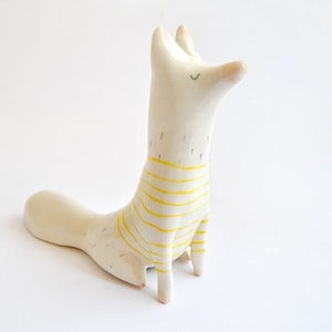 Ceramic Arctic Fox Figurine, Sitting oh his Feets, in White Clay and Decorated with Yellow Stripes. Ready to Ship