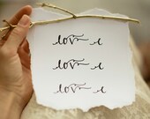 LOVE sign or photo prop, with gold branch