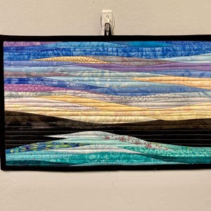 May include: A rustic wooden sign with the text "Welcome to our home" in a handwritten style. The sign features a distressed finish and a simple, inviting design, perfect for a front porch or entryway.