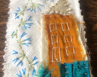 Slow Stitch Embroidery Art: Tall House with Blue Flowers Garden