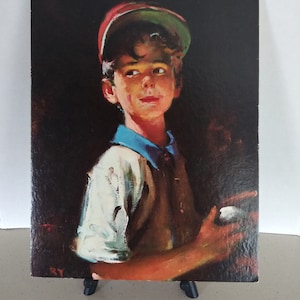 May include: A painting of a young boy wearing a red and green baseball cap, a white shirt, a brown vest, and a blue shirt collar. The boy is looking to the right and holding a white object in his right hand. The background is dark.
