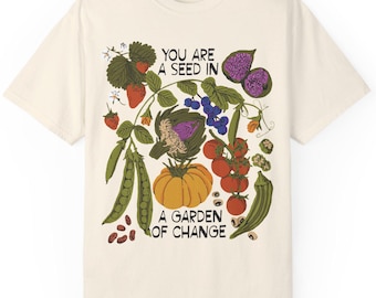 T-shirt You Are A Seed In A Garden of Change | sociale rechtvaardigheid, bevrijding, afschaffing, inclusieve kunst, solidariteit, hoopvolle kunst, milieu