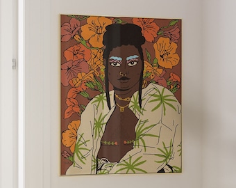 May include: A framed wall art print featuring a stylized illustration of a person with dark skin, wearing a white shirt with green palm leaf patterns. The background displays orange flowers on a brown field. The person has blue eyebrows and gold jewelry.